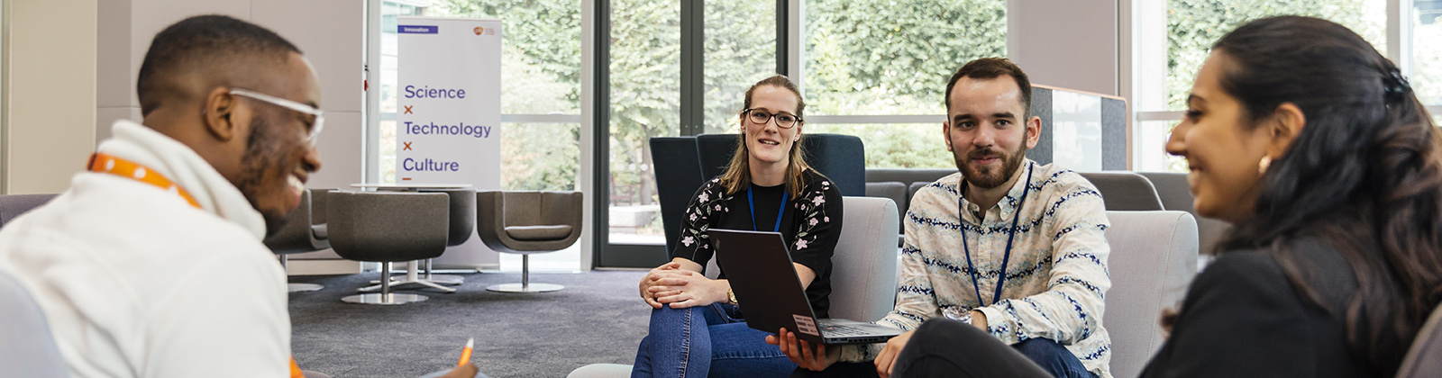 Image of a group of people talking in a business environment